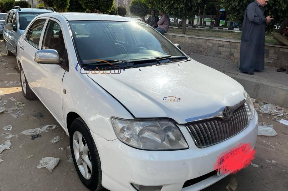 Corolla Toyota 2004 Mansoura White 6059326 - Car for sale : Hatla2ee