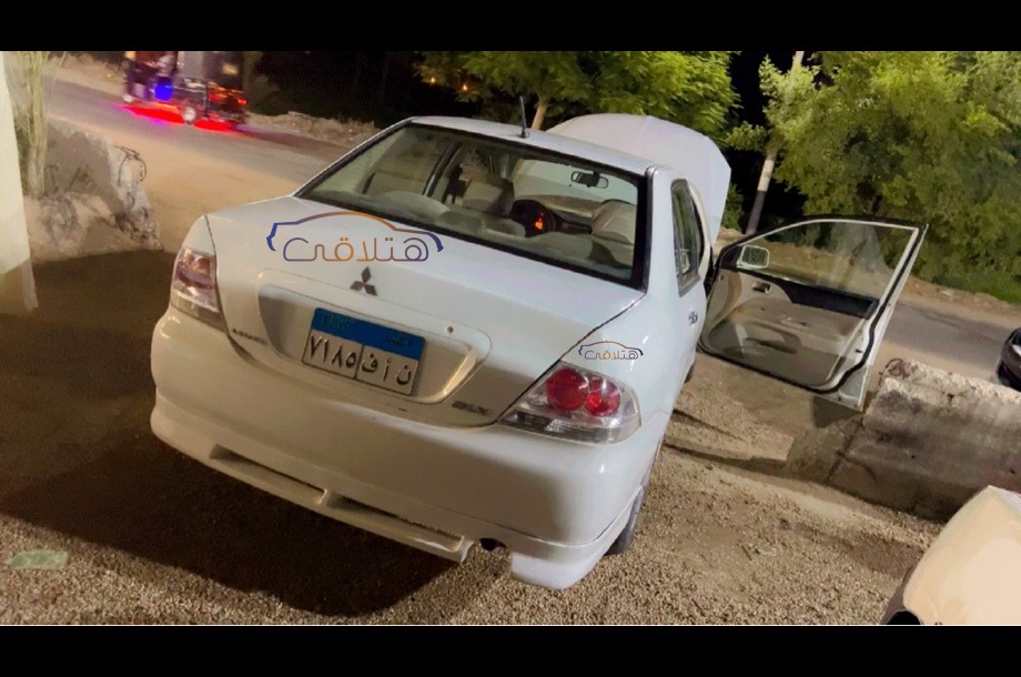 Lancer Puma Mitsubishi 2014 Sohag White 6691808 - Car for sale : Hatla2ee