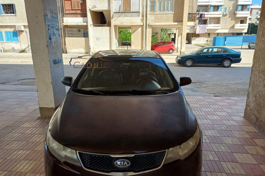 Cerato Kia 2010 Ismailia Eggplant 6708124 Car for sale Hatla2ee