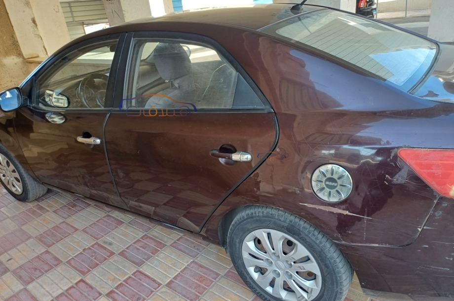 Cerato Kia 2010 Ismailia Eggplant 6708124 Car for sale Hatla2ee
