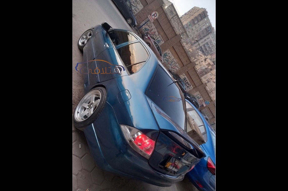 Lancer Puma Mitsubishi 2010 Giza Blue 6865611 - Car for sale : Hatla2ee