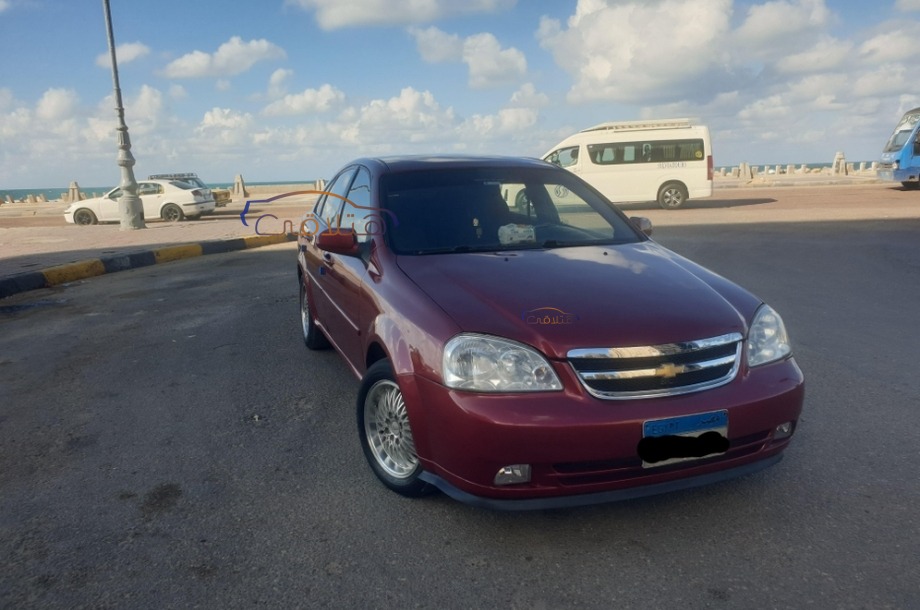 Optra Chevrolet 2013 Alexandria Red 6875643 - Car for sale : Hatla2ee