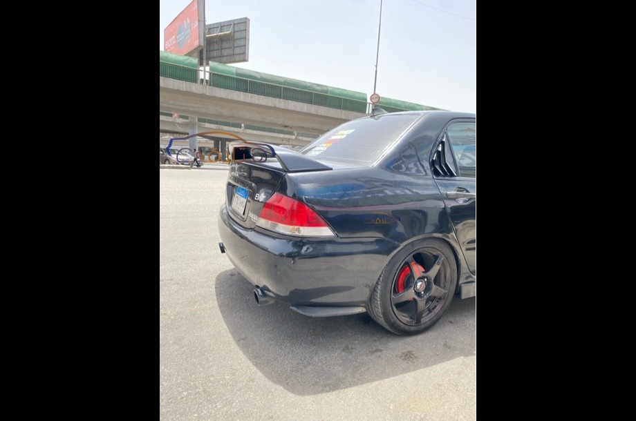 Lancer Puma Mitsubishi 2006 Cairo Black 6904630 - Car for sale : Hatla2ee