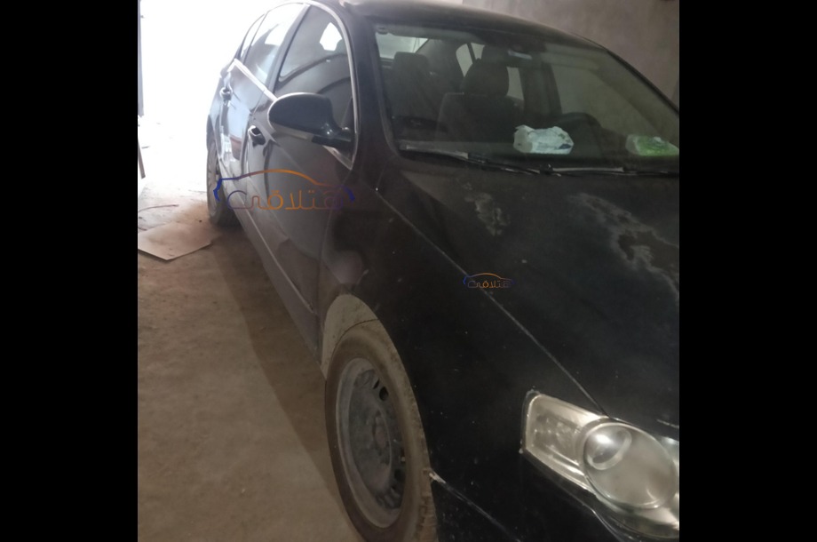 Passat Volkswagen أسود