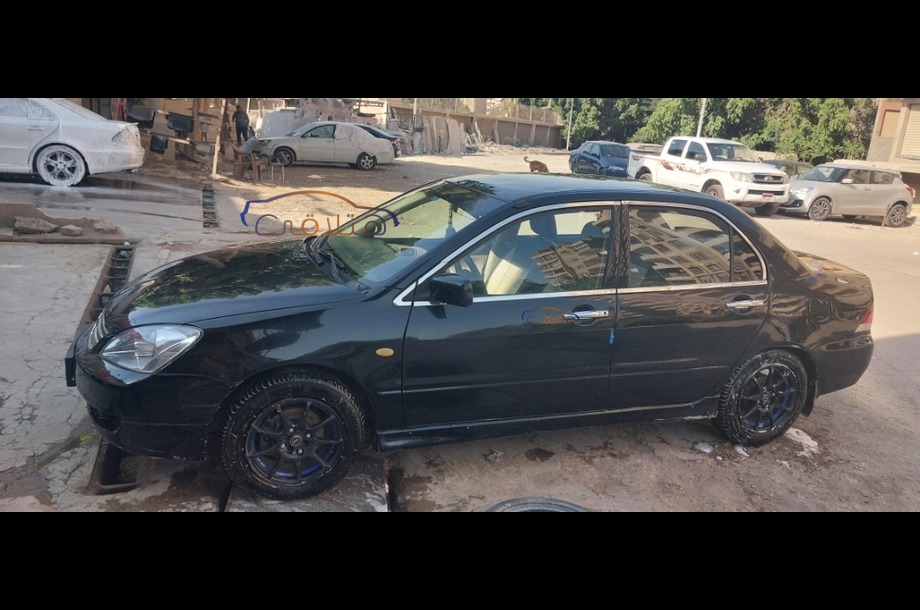 Lancer Puma Mitsubishi 2009 Maadi Black 7012136 - Car for sale : Hatla2ee