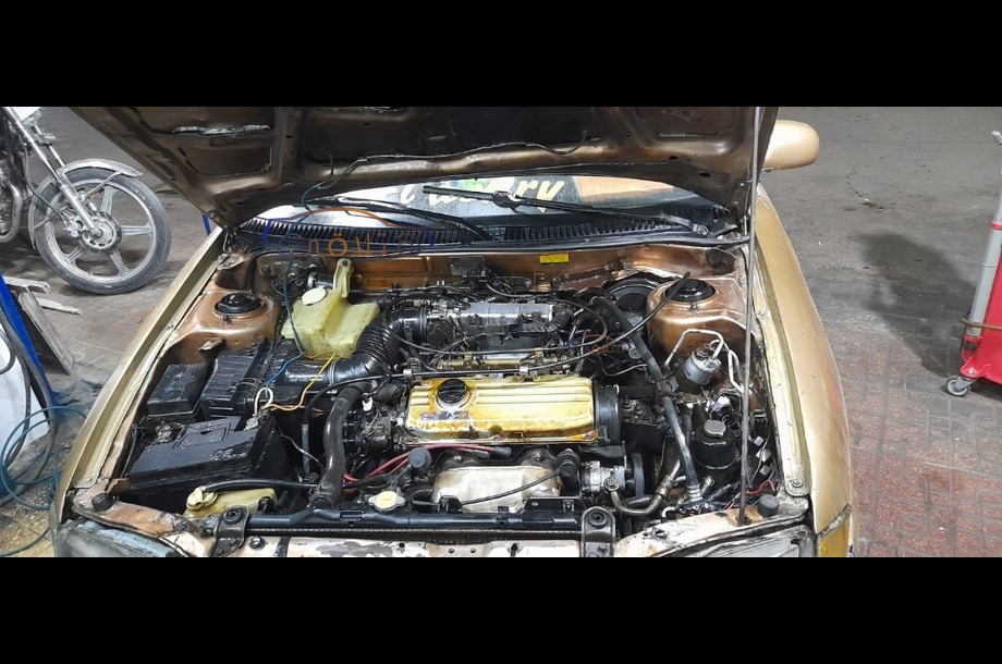 Wira Proton ذهبي