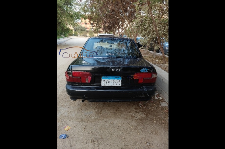 Wira Proton أسود