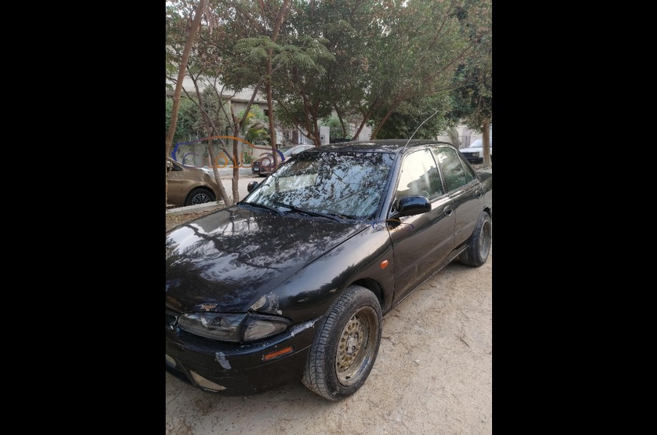 Wira Proton أسود