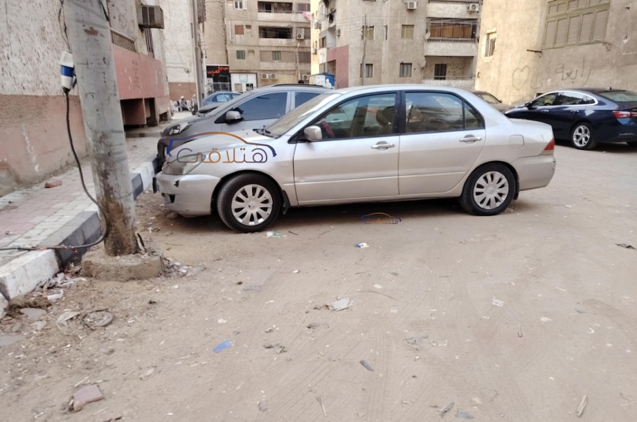 Lancer Puma Mitsubishi فضي