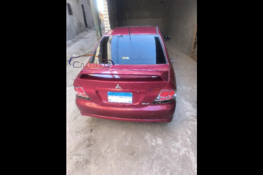 Lancer Puma Mitsubishi احمر غامق