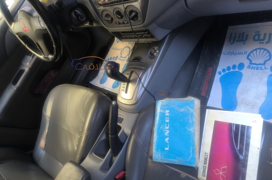 Lancer Puma Mitsubishi احمر غامق