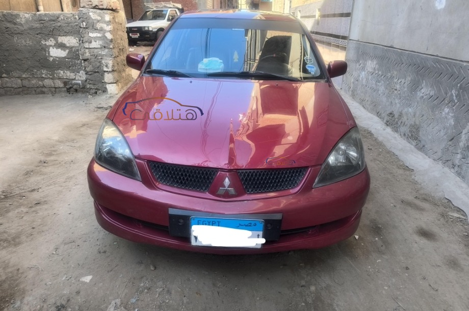 Lancer Puma Mitsubishi احمر غامق