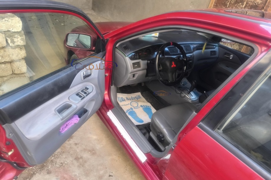 Lancer Puma Mitsubishi احمر غامق