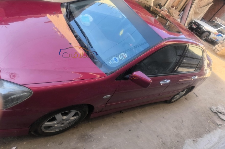 Lancer Puma Mitsubishi احمر غامق