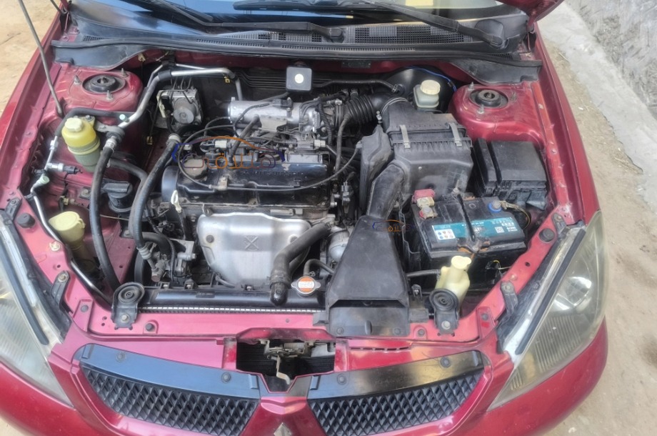 Lancer Puma Mitsubishi احمر غامق
