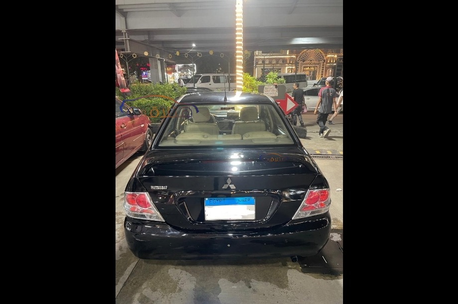 Lancer Puma Mitsubishi أسود