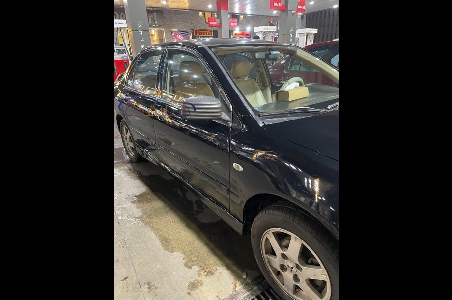 Lancer Puma Mitsubishi أسود