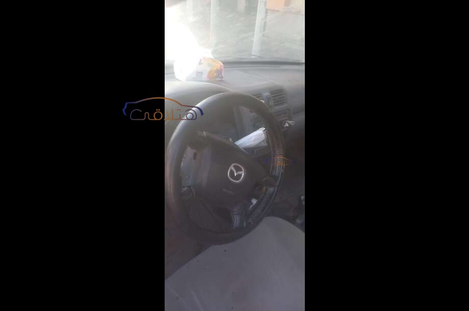 323 Mazda الأزرق الداكن