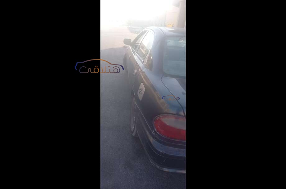 323 Mazda الأزرق الداكن