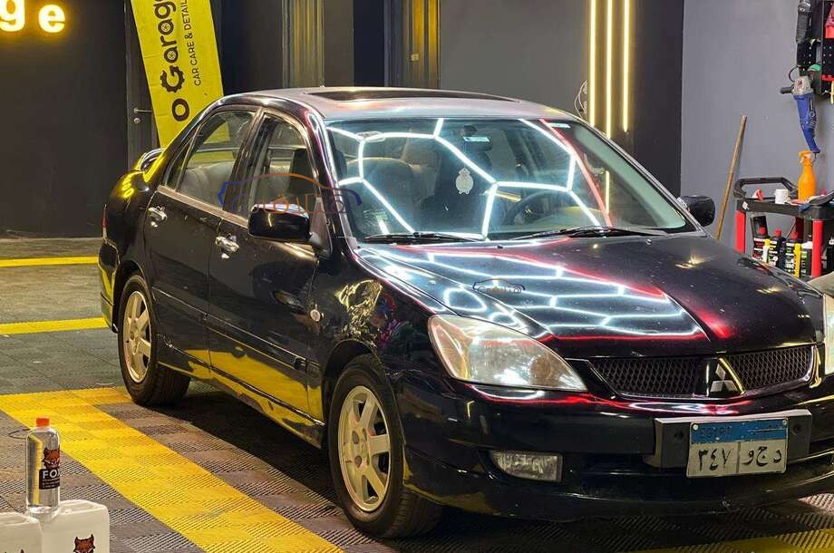 Lancer Puma Mitsubishi أسود