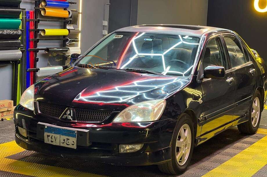 Lancer Puma Mitsubishi أسود