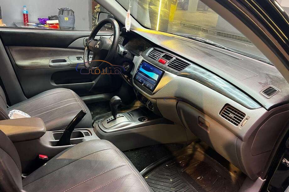 Lancer Puma Mitsubishi أسود