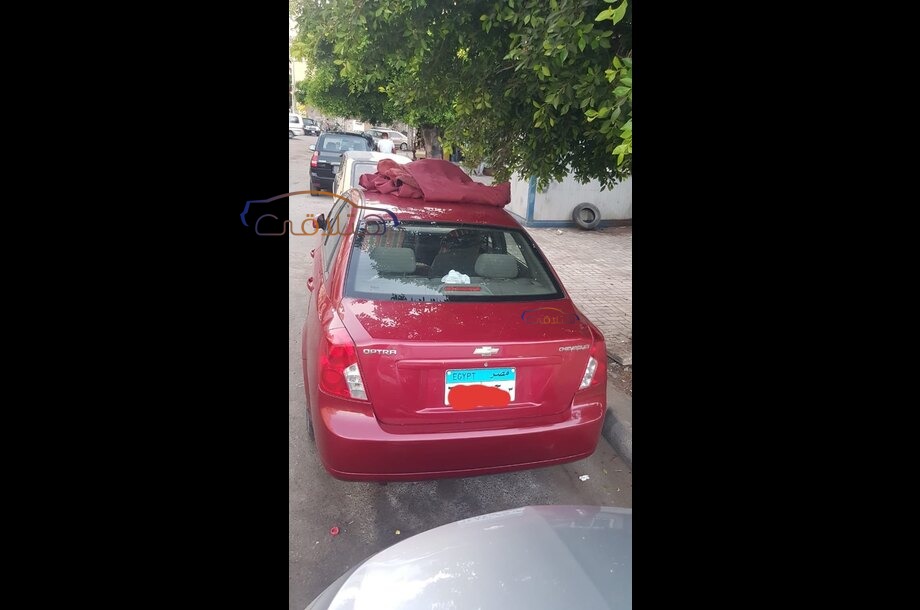 Optra Chevrolet احمر غامق