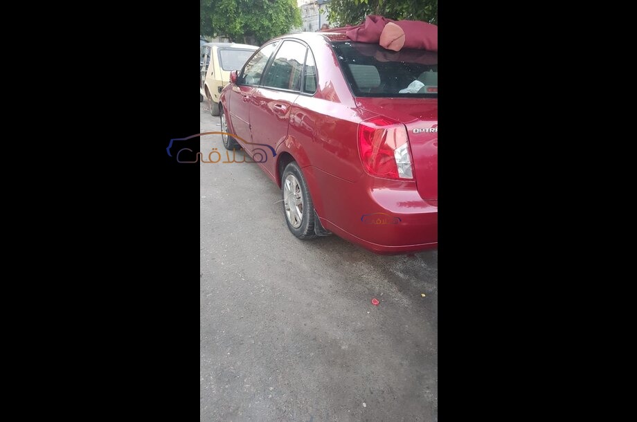 Optra Chevrolet احمر غامق