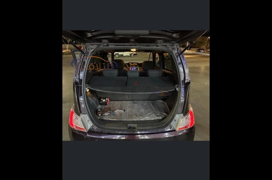 Materia Daihatsu احمر غامق