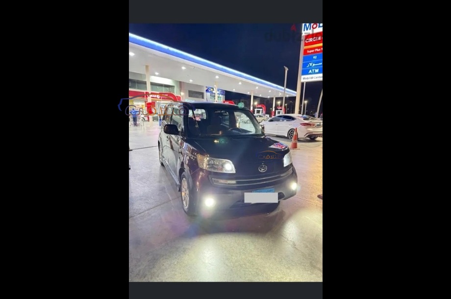 Materia Daihatsu احمر غامق