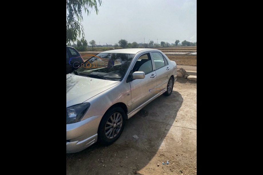 Lancer Puma Mitsubishi فضي