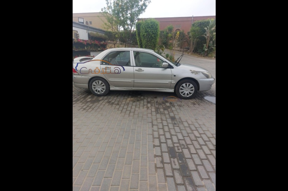 Lancer Puma Mitsubishi فضي