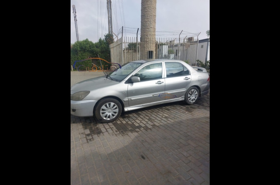 Lancer Puma Mitsubishi فضي