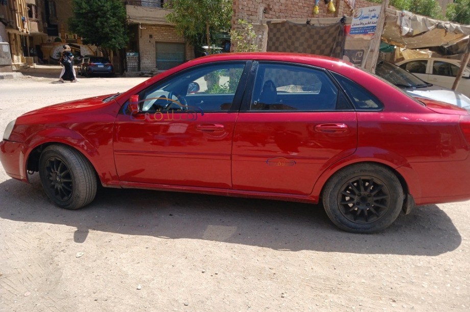 Optra Chevrolet احمر غامق