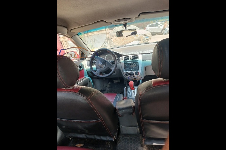 Optra Chevrolet احمر غامق