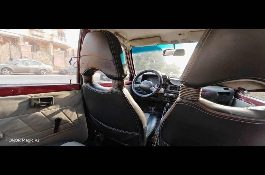 Maruti Suzuki احمر غامق