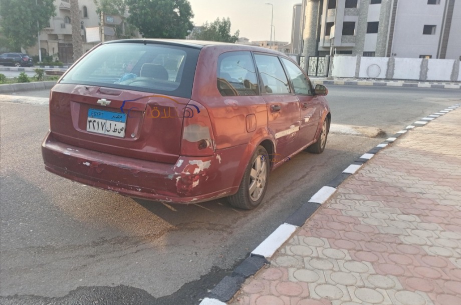 Optra Chevrolet احمر غامق