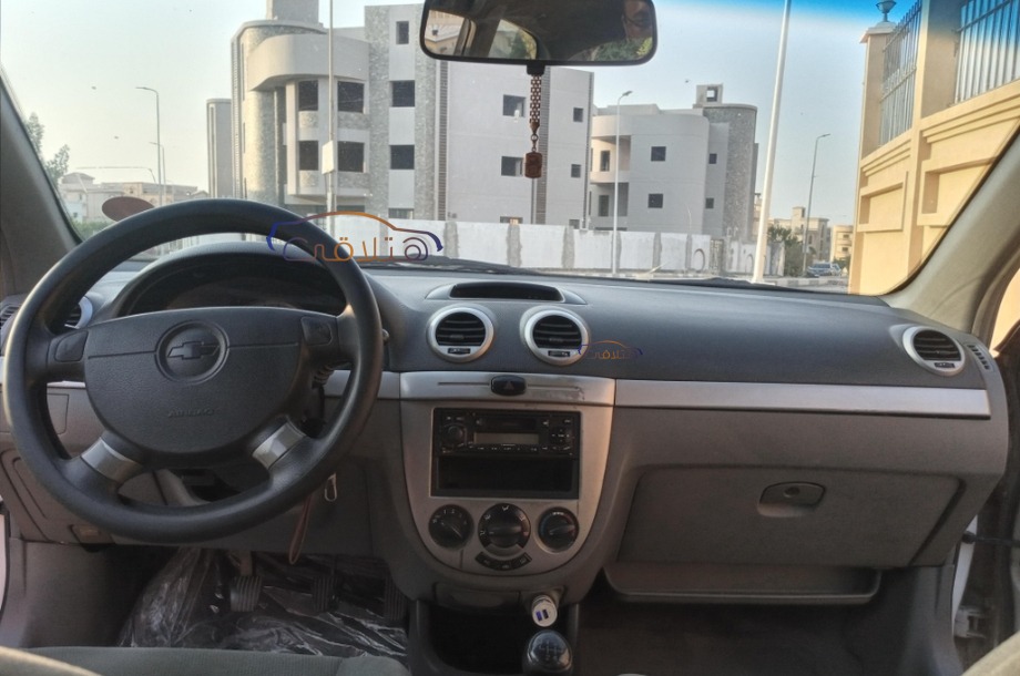 Optra Chevrolet احمر غامق