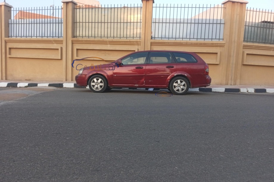 Optra Chevrolet احمر غامق