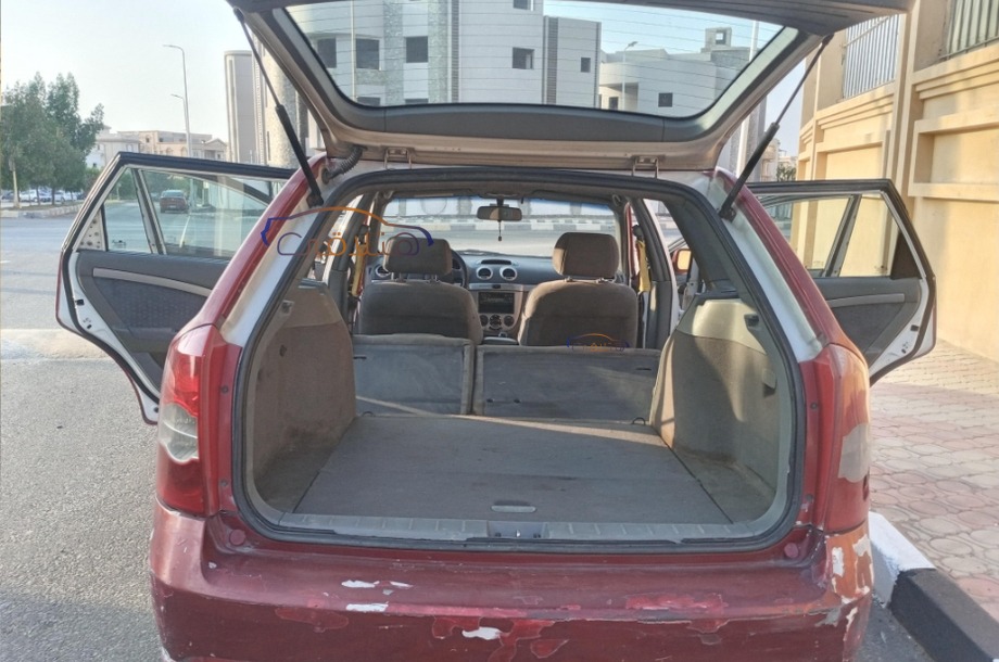 Optra Chevrolet احمر غامق