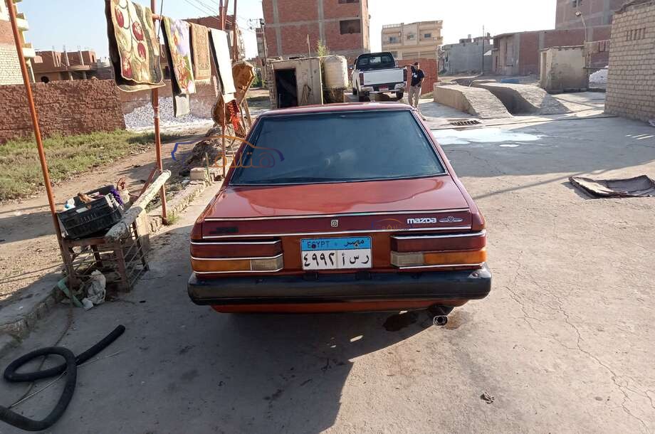 323 Mazda احمر