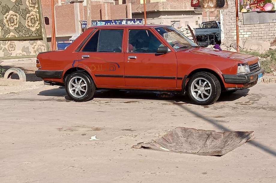 323 Mazda احمر