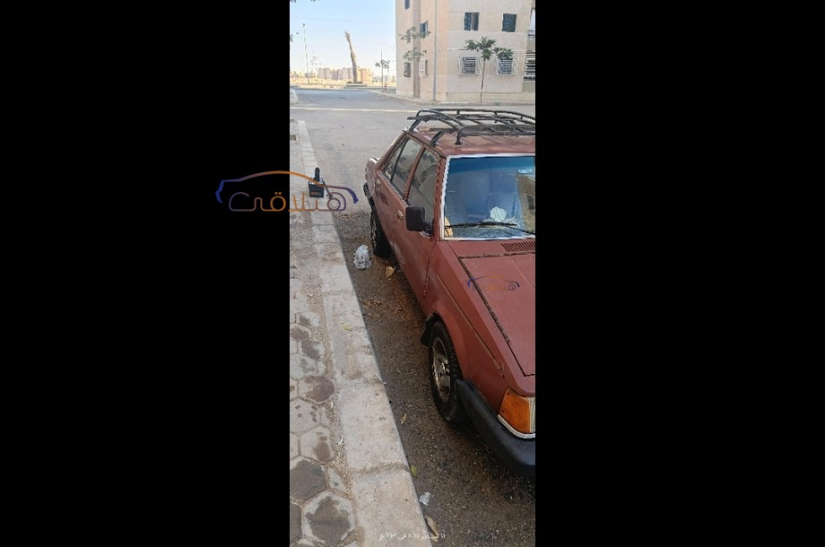 323 Mazda احمر غامق