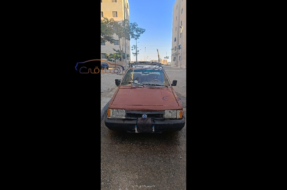 323 Mazda احمر غامق