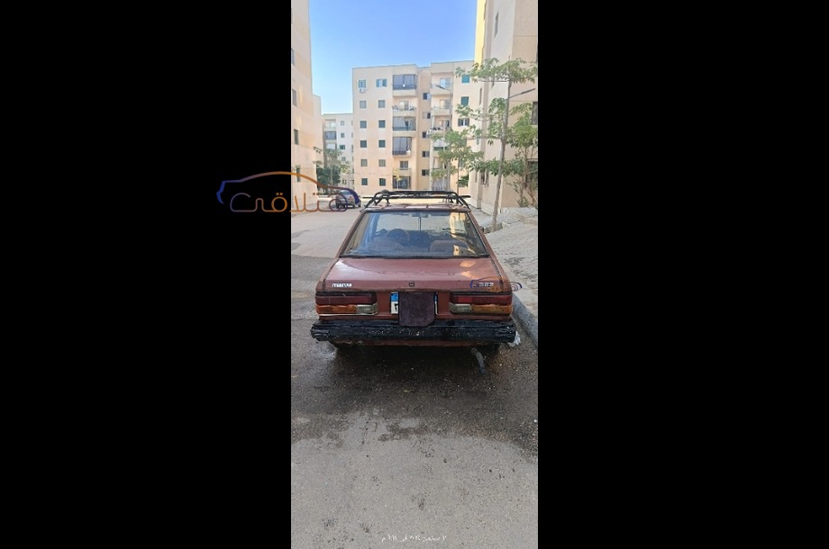 323 Mazda احمر غامق
