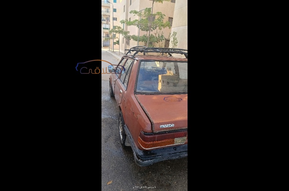 323 Mazda احمر غامق