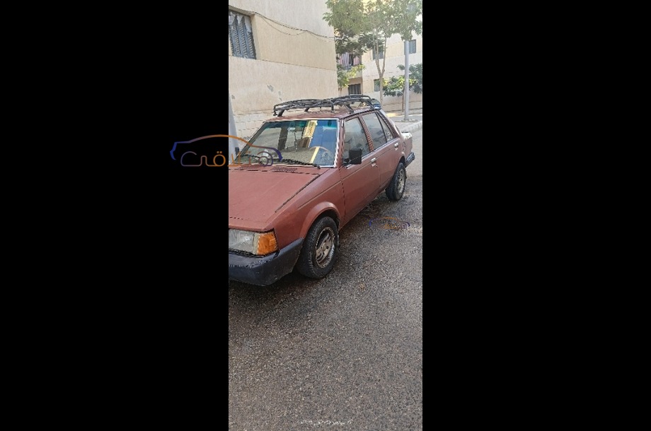 323 Mazda احمر غامق