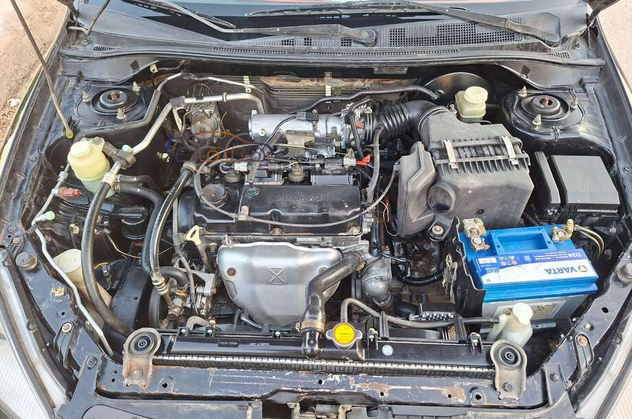 Lancer Puma Mitsubishi أسود