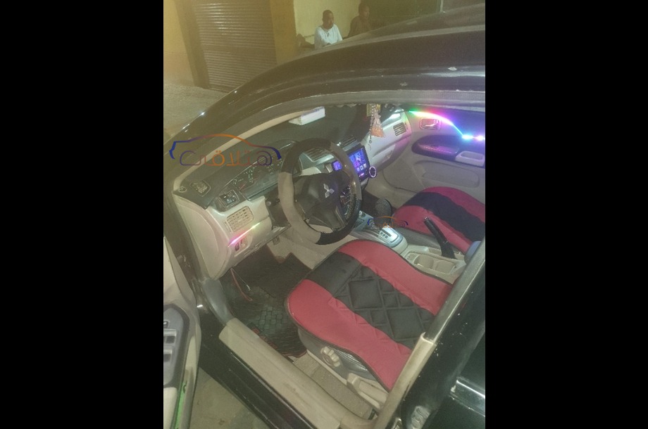 Lancer Puma Mitsubishi أسود