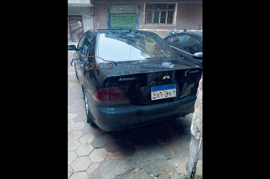 Lancer Puma Mitsubishi أسود